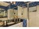 Stylishly designed main bathroom featuring black countertop and shower with glass enclosure at 26687 Raphis Royale Blvd, Englewood, FL 34223