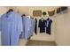Spacious walk-in closet provides ample space for storage with shelving, rods, and room for accessories at 26687 Raphis Royale Blvd, Englewood, FL 34223