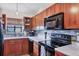 Beautiful kitchen with warm wood cabinets and modern stainless steel appliances at 2906 63Rd W St # 206, Bradenton, FL 34209