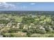 A scenic aerial shot showcases the home's location within a vibrant neighborhood, interspersed with lakes and green spaces at 2914 Dick Wilson Dr, Sarasota, FL 34240