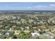 A beautiful aerial view of a lovely home in a verdant community filled with homes, lakes, and golf courses at 2914 Dick Wilson Dr, Sarasota, FL 34240