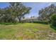 A sprawling lawn and mature trees surround this home's backyard at 2914 Dick Wilson Dr, Sarasota, FL 34240