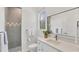 Bathroom showcasing modern tile, vanity, and walk-in shower, complemented by natural light from a window at 2914 Dick Wilson Dr, Sarasota, FL 34240