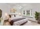 Tastefully furnished bedroom with a large bay window, plush rug, and luxurious bedding at 2914 Dick Wilson Dr, Sarasota, FL 34240