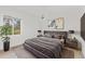 This bedroom offers a comfortable, well-lit space with stylish decor and modern furnishings at 2914 Dick Wilson Dr, Sarasota, FL 34240