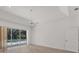 Bright bedroom with hardwood floors and sliding glass doors that open up to views of the pool at 2914 Dick Wilson Dr, Sarasota, FL 34240