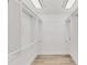 Walk-in closet with hardwood floors, ample shelving, and plenty of room for storage at 2914 Dick Wilson Dr, Sarasota, FL 34240