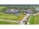 Aerial view of the beautiful clubhouse with outdoor seating overlooking the lush golf course at 2914 Dick Wilson Dr, Sarasota, FL 34240
