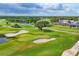 Scenic golf course featuring sand traps, mature trees, and serene water features for a challenging game at 2914 Dick Wilson Dr, Sarasota, FL 34240