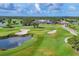 Beautifully designed golf course with mature trees, pristine greens, and water hazards for an enjoyable experience at 2914 Dick Wilson Dr, Sarasota, FL 34240