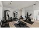Home gym with mirrored wall and equipped with modern machines and free weights at 2914 Dick Wilson Dr, Sarasota, FL 34240