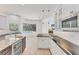 Bright kitchen view with an island and a glimpse of the pool and outdoor living area at 2914 Dick Wilson Dr, Sarasota, FL 34240