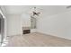 Spacious living room with a fireplace, built-in shelves, and ample natural light at 2914 Dick Wilson Dr, Sarasota, FL 34240