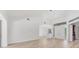 Bright living area with wood-look flooring, neutral palette, and elegant double doors, ready for personalization at 2914 Dick Wilson Dr, Sarasota, FL 34240