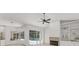 Bright living room featuring hardwood floors, fireplace, and sliding doors leading to the pool area at 2914 Dick Wilson Dr, Sarasota, FL 34240