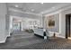 Warm lobby with sleek reception desk, elegant chandelier, marble accent wall and comfortable seating at 2914 Dick Wilson Dr, Sarasota, FL 34240