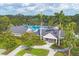 Stunning pool and recreation center with lush landscaping, creating a serene and inviting atmosphere at 2914 Dick Wilson Dr, Sarasota, FL 34240