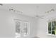 Open floor plan featuring french doors, lots of light, and wood-look tile at 2914 Dick Wilson Dr, Sarasota, FL 34240