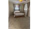 Cozy bedroom featuring a comfortable bed, carpet flooring, and ample natural light at 3060 Courtland St, Sarasota, FL 34237