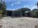 Exterior view showing a covered parking area, and a gravel yard at 3060 Courtland St, Sarasota, FL 34237