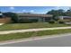 Charming single-story home with well-maintained lawn and mature landscaping at 3060 Courtland St, Sarasota, FL 34237