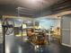 Open interior features high ceilings, mezzanine and an island with stool seating at 3060 Courtland St, Sarasota, FL 34237