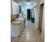 Spacious laundry room equipped with modern washer and dryer, ample storage, and tile flooring at 3060 Courtland St, Sarasota, FL 34237
