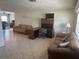 Bright living room featuring tile floors, sofas, and a desk area for added functionality at 3060 Courtland St, Sarasota, FL 34237