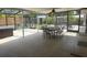 Spacious screened patio with outdoor seating and a view of the backyard at 3060 Courtland St, Sarasota, FL 34237
