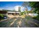 Spacious yard featuring green turf, providing a private outdoor retreat at 3468 Roslyn Rd, Venice, FL 34293