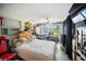 Well-lit bedroom featuring sliding glass doors, a ceiling fan, and plenty of space for furniture at 3468 Roslyn Rd, Venice, FL 34293