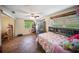 Comfortable bedroom offers lots of natural light, tile flooring, and a ceiling fan for added comfort at 3468 Roslyn Rd, Venice, FL 34293