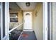Inviting front entrance with a white door, a welcoming mat, and a charming star decoration at 3468 Roslyn Rd, Venice, FL 34293