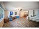 Comfortable living room with a ceiling fan and a view into the dining area at 3468 Roslyn Rd, Venice, FL 34293