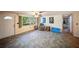 Inviting living room with tile floors, a large window, and an armchair at 3468 Roslyn Rd, Venice, FL 34293
