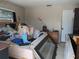 Cluttered bedroom filled with debris and damaged furniture, showing signs of neglect and disrepair at 3646 Lakewood Dr, Sarasota, FL 34232