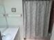 Cozy bathroom featuring a floral shower curtain, a well-lit vanity and matching decor at 3673 Somerville Dr # 1510, Sarasota, FL 34232