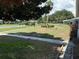 Community green space with manicured lawns, shrubbery, and mature trees at 3673 Somerville Dr # 1510, Sarasota, FL 34232
