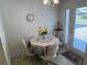 Bright dining nook with a table set for four and a view to the outside at 3673 Somerville Dr # 1510, Sarasota, FL 34232