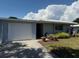 Charming single-story home with a well-maintained lawn, flowerbeds and a one car garage at 3673 Somerville Dr # 1510, Sarasota, FL 34232