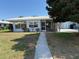 Charming single-story home with a well-maintained lawn and lush landscaping at 3673 Somerville Dr # 1510, Sarasota, FL 34232