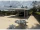 Covered community area featuring seating and grilling area near the pool at 3673 Somerville Dr # 1510, Sarasota, FL 34232