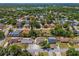 Aerial view of neighborhood showcasing the home's location near lush landscaping and water at 4076 Vana Dr, Sarasota, FL 34241