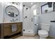 Updated bathroom features a modern vanity and tiled shower with glass door at 4076 Vana Dr, Sarasota, FL 34241