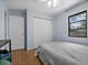 Bright bedroom with hardwood floors, ceiling fan, closet and ample natural light at 4076 Vana Dr, Sarasota, FL 34241