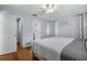 View of bedroom with wood floors and ensuite bathroom featuring a tiled shower at 4076 Vana Dr, Sarasota, FL 34241