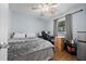 Bedroom boasts a ceiling fan, hardwood flooring, and a window at 4076 Vana Dr, Sarasota, FL 34241