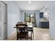 Eat-in kitchen with a dining table, chairs, and sliding doors to the backyard at 4076 Vana Dr, Sarasota, FL 34241