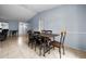 Bright dining area with a wooden table, six chairs, and tile flooring at 4076 Vana Dr, Sarasota, FL 34241