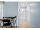 Hallway with a desk and natural light leads to a front door, creating a bright interior at 4076 Vana Dr, Sarasota, FL 34241